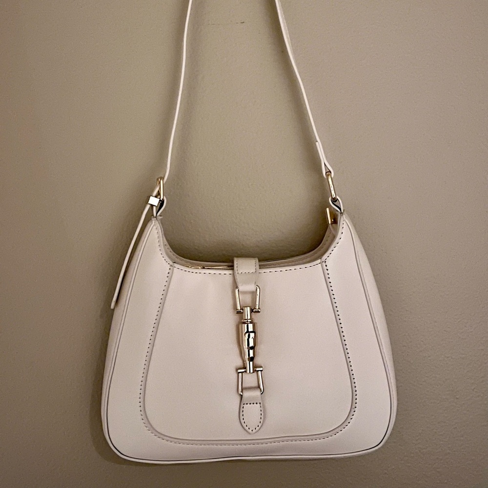 Ivory white handbag with gold accents